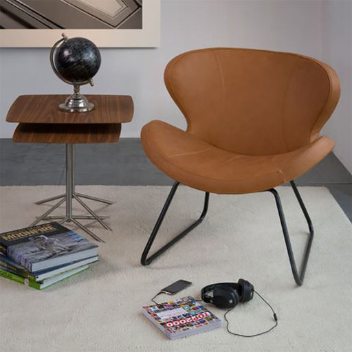 Design fauteuil peggy van Bree's New World cognac met sledeframe