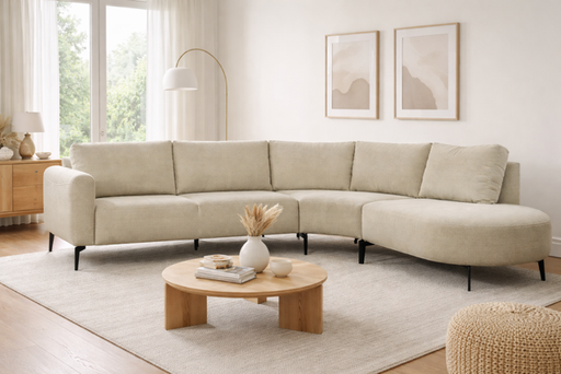 Afgeronde modulaire witte hoekbank met zachte zit en losse rugkussens, moderne uitstraling en comfortabel design in stof, met zwarte poot.