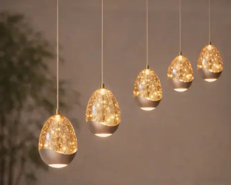 hanglamp-egg-5-lichts-108-cm-champagne in showroom