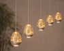 hanglamp-egg-5-lichts-108-cm-champagne in showroom